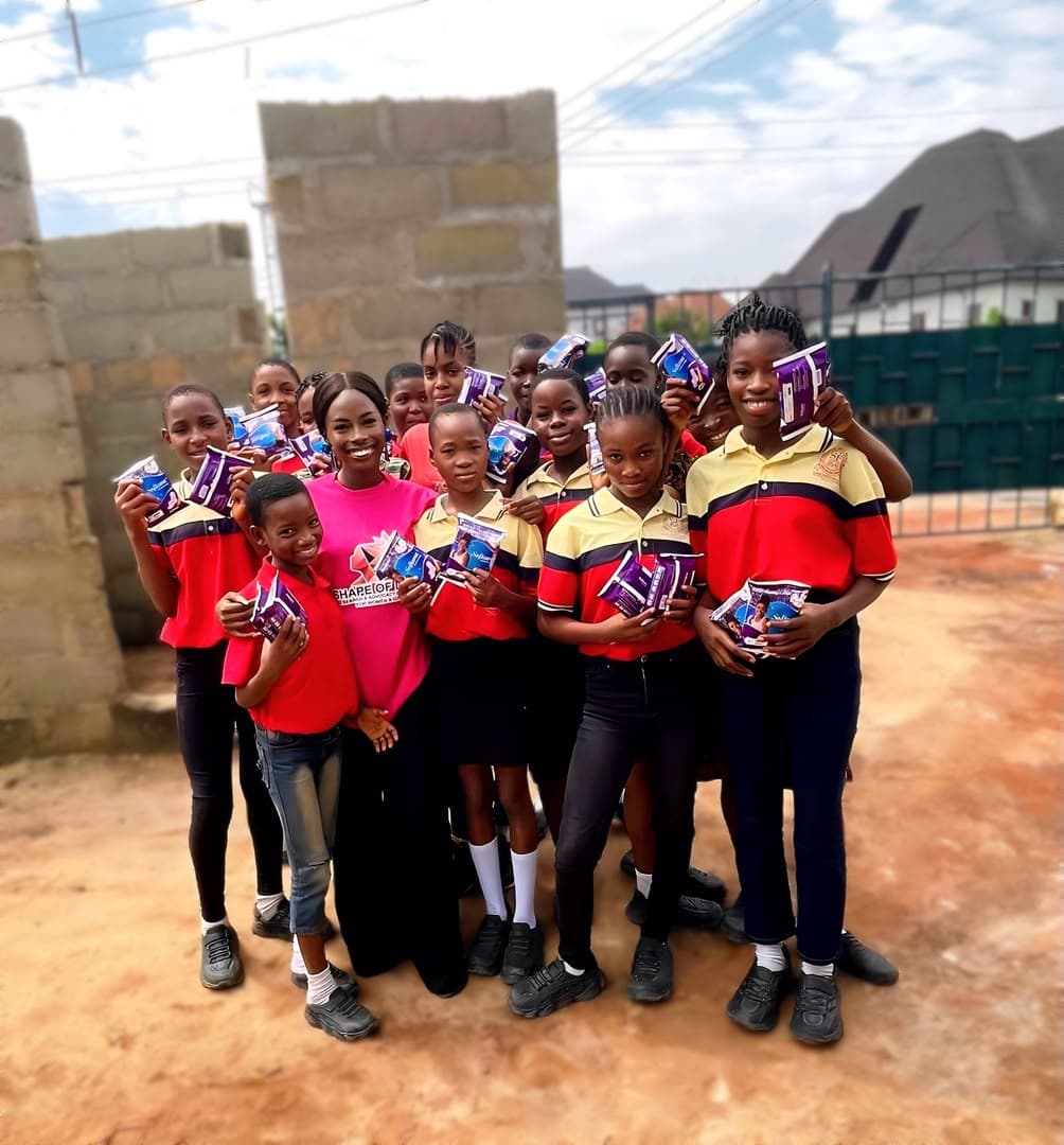 Pupils receiving support during a menstrual health outreach